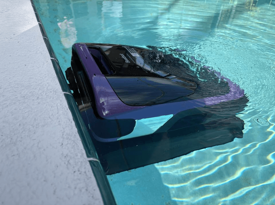 Beatbot Sora 70 cleaning the pool waterline at the edge